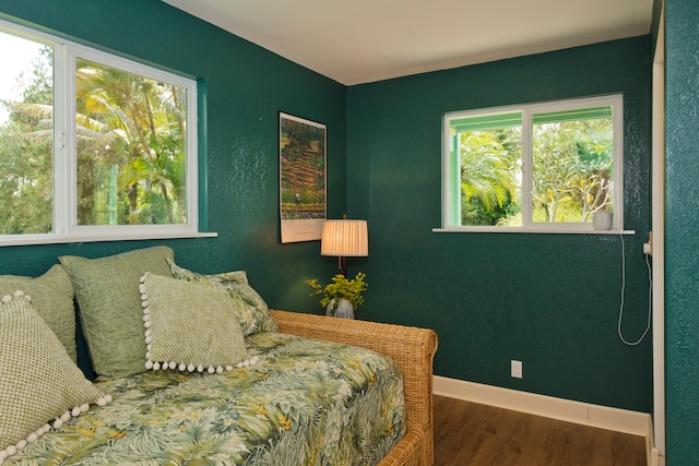 bedroom with dark wood-type flooring