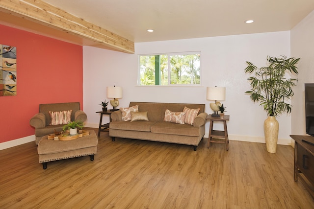 living room with light wood-style floors, recessed lighting, and baseboards