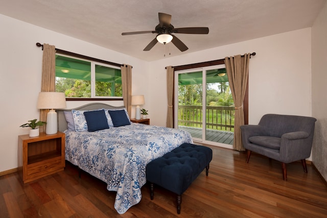 bedroom with dark hardwood / wood-style flooring, access to exterior, multiple windows, and ceiling fan