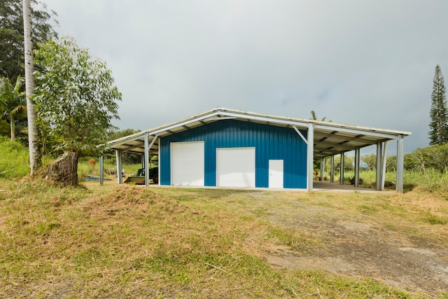 exterior space featuring a garage and a carport