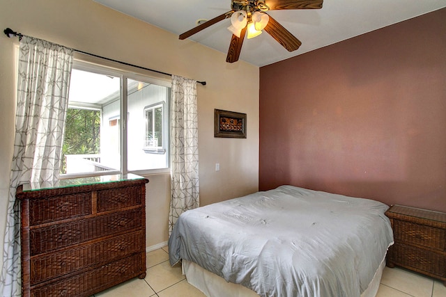 tiled bedroom with ceiling fan