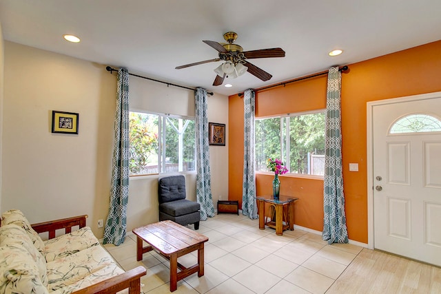 interior space featuring light wood-type flooring and ceiling fan