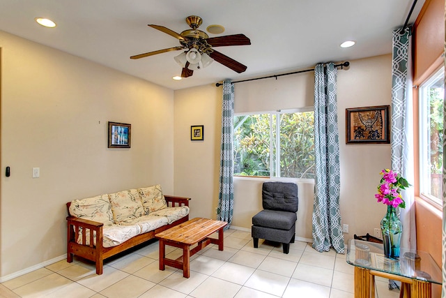 tiled living room featuring ceiling fan