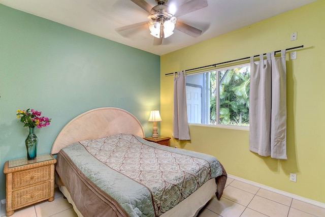 tiled bedroom featuring ceiling fan