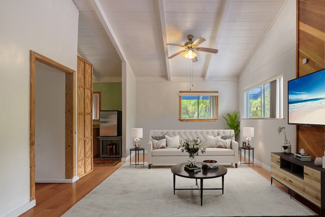 living room featuring lofted ceiling with beams, ceiling fan, and light hardwood / wood-style floors