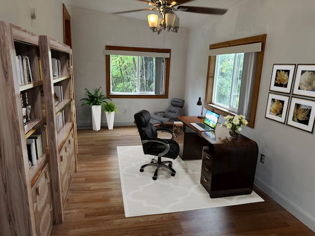 office area with ceiling fan and light hardwood / wood-style floors