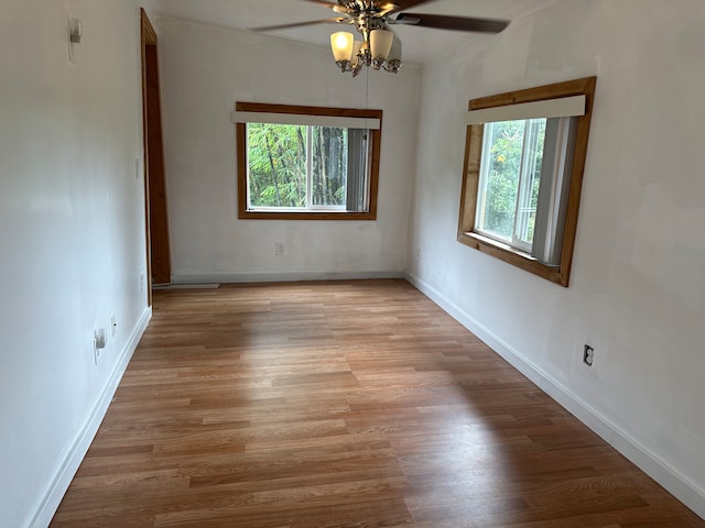 empty room featuring ceiling fan and wood-type flooring