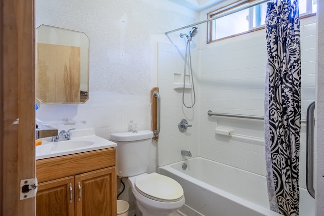 full bathroom featuring shower / bath combo with shower curtain, toilet, and vanity