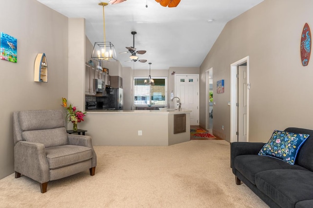 carpeted living room featuring lofted ceiling, sink, and ceiling fan