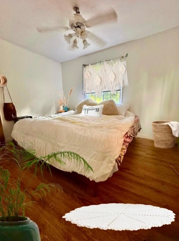 bedroom featuring ceiling fan and wood-type flooring