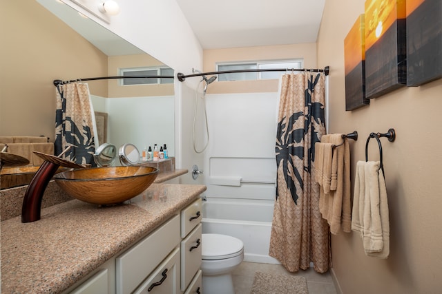 full bathroom with tile patterned floors, shower / bath combo, toilet, and vanity