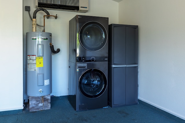 washroom with carpet flooring, stacked washing maching and dryer, and electric water heater