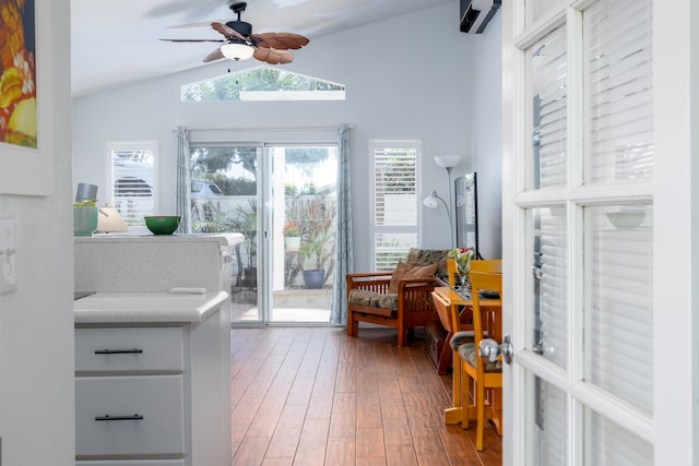 interior space featuring lofted ceiling, light hardwood / wood-style flooring, ceiling fan, and access to outside