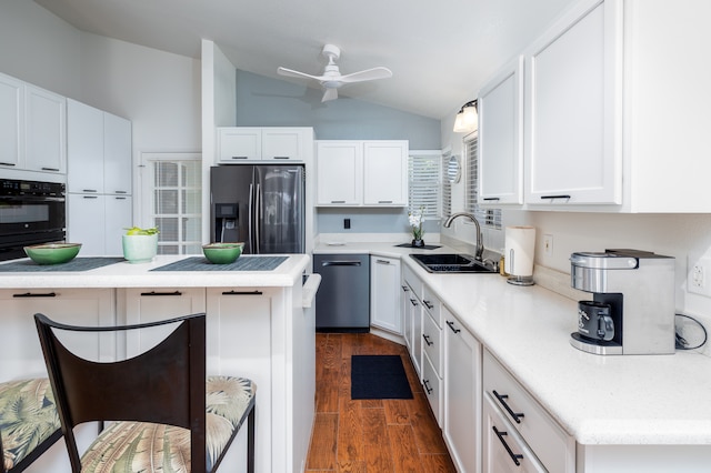 kitchen with sink, ceiling fan, black oven, dark wood-type flooring, and refrigerator with ice dispenser