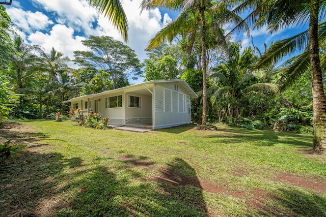 view of yard featuring a sunroom