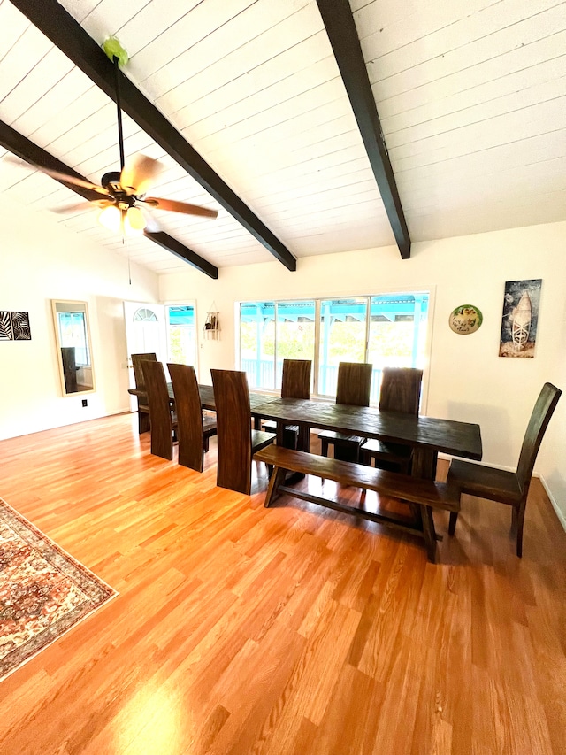 dining area featuring vaulted ceiling with beams, light hardwood / wood-style floors, and ceiling fan