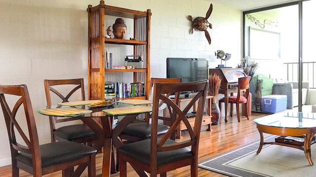 dining area with hardwood / wood-style flooring