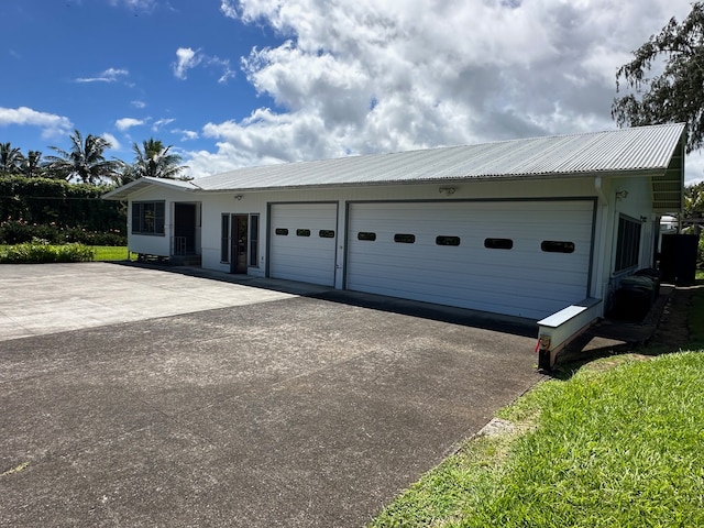 single story home featuring a garage