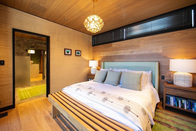 bedroom featuring wood ceiling, a notable chandelier, and wood-type flooring