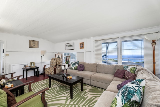 living room with wood-type flooring and ornamental molding