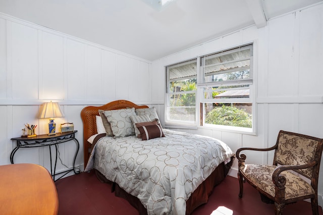 bedroom featuring lofted ceiling with beams