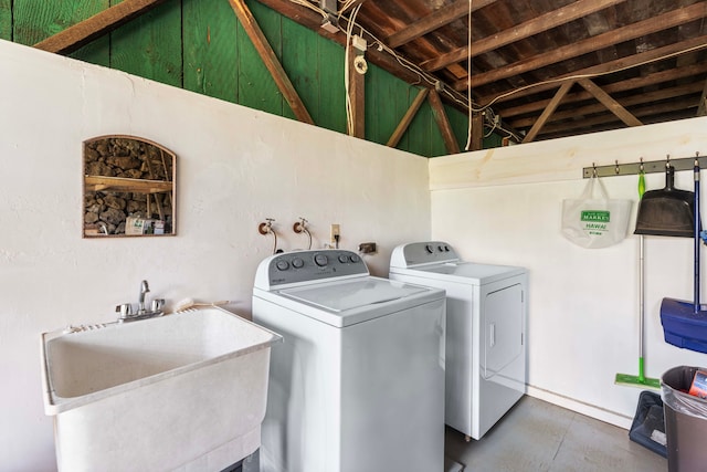 laundry area featuring sink and washing machine and clothes dryer