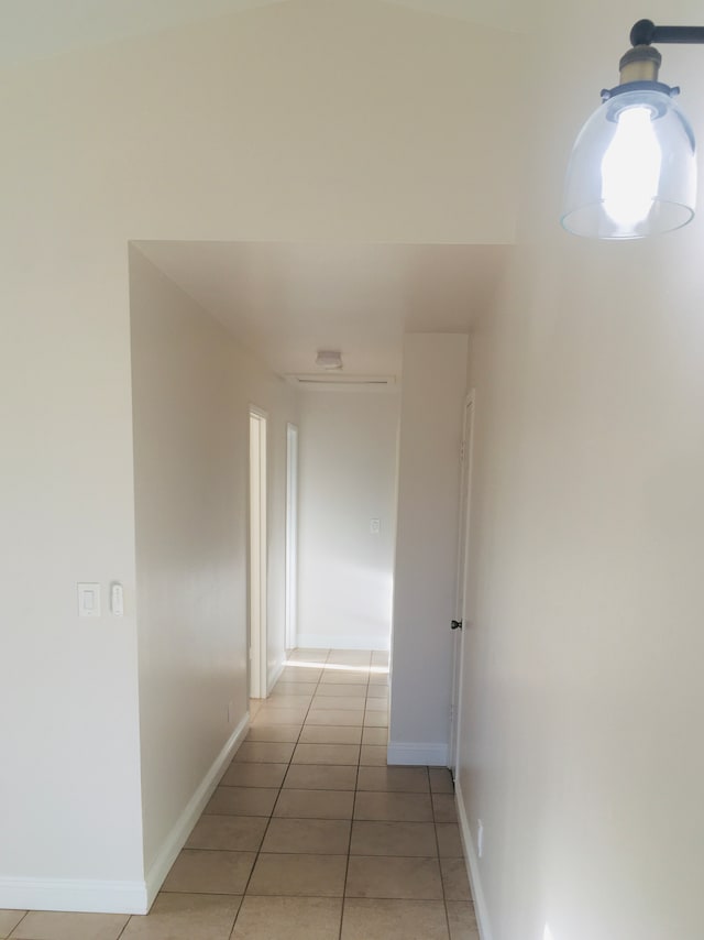 corridor with light tile patterned floors