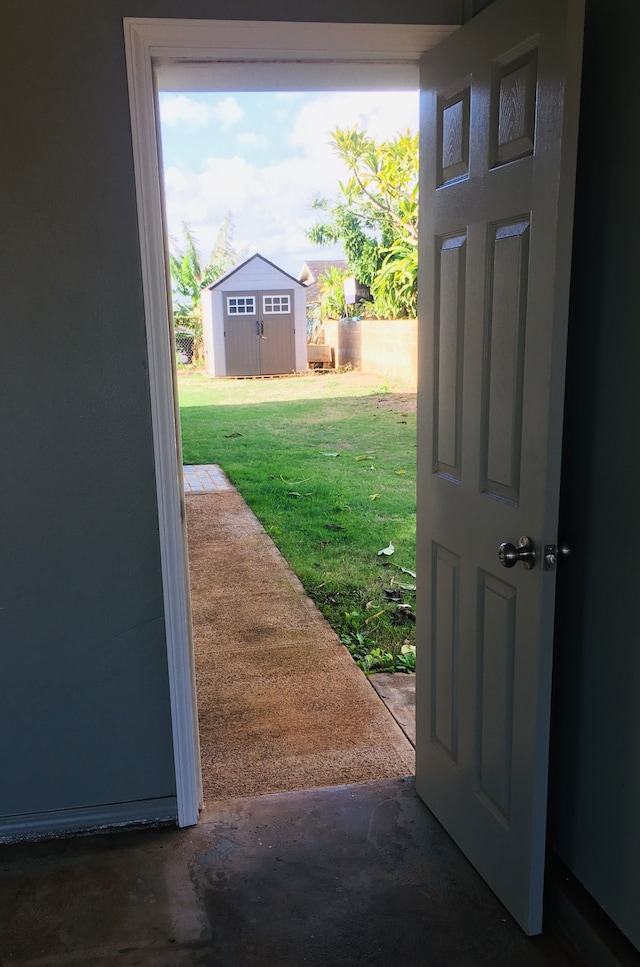 doorway featuring concrete flooring and a healthy amount of sunlight