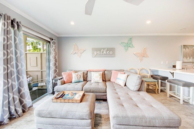 living room with crown molding and ceiling fan