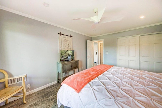 bedroom with a closet, ceiling fan, dark hardwood / wood-style flooring, and ornamental molding