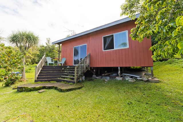 rear view of house with a yard