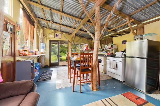 kitchen featuring stainless steel fridge and white gas range