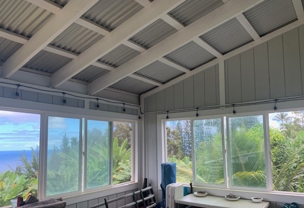 sunroom / solarium with a water view and a wealth of natural light