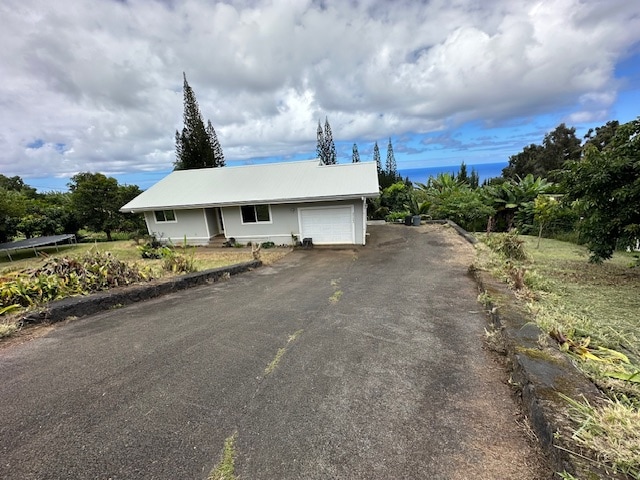 single story home featuring a garage