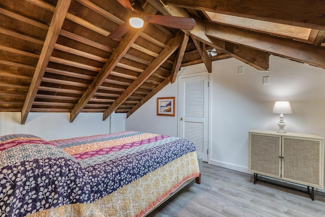 bedroom featuring ceiling fan, hardwood / wood-style floors, wooden ceiling, and vaulted ceiling