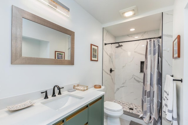 bathroom featuring vanity, toilet, and walk in shower