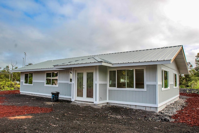 rear view of property with french doors