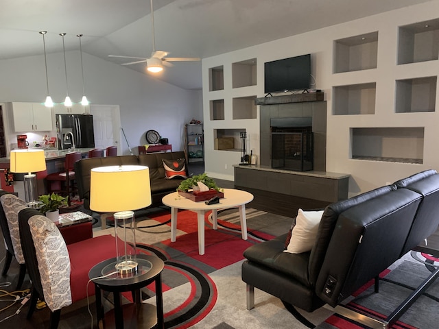 living room featuring high vaulted ceiling and ceiling fan