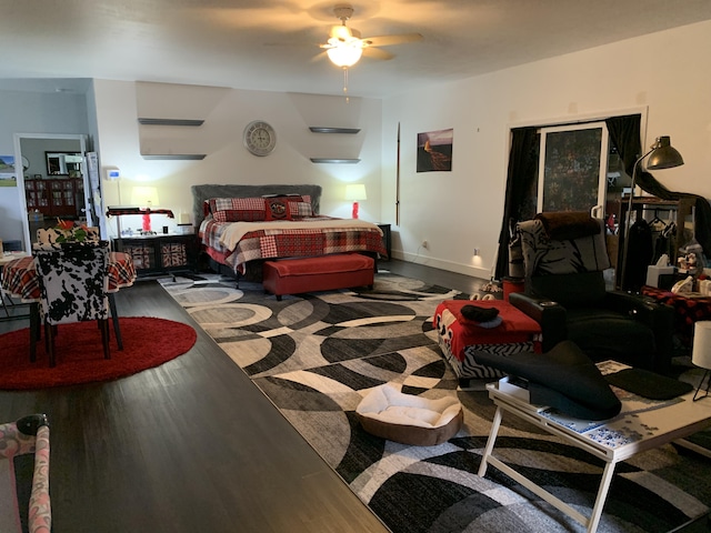 bedroom with hardwood / wood-style flooring and ceiling fan