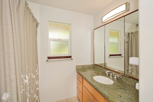 bathroom featuring tile patterned floors and vanity