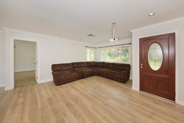 entrance foyer featuring light hardwood / wood-style flooring and ornamental molding