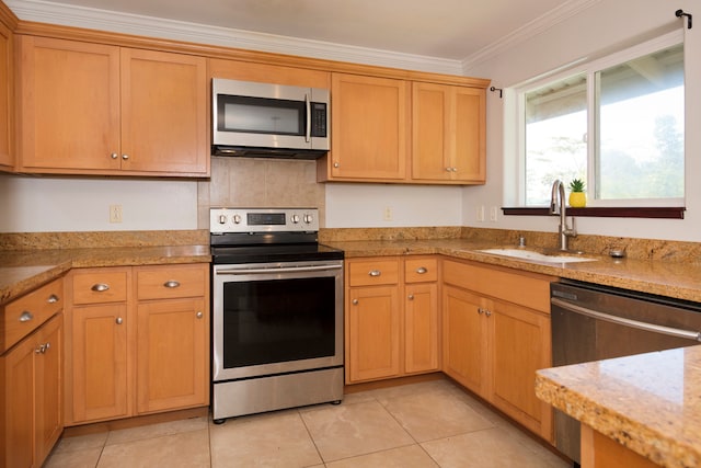 kitchen with crown molding, sink, light tile patterned floors, and stainless steel appliances