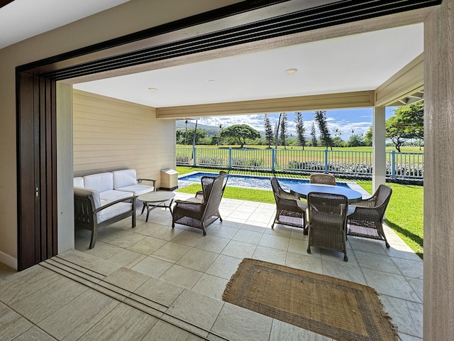 view of patio featuring a fenced in pool and outdoor lounge area