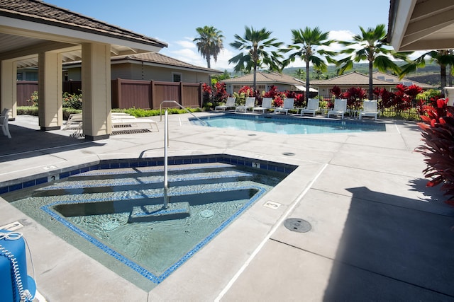 view of pool featuring a community hot tub and a patio