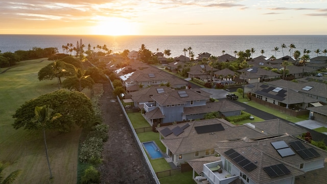 aerial view at dusk with a water view