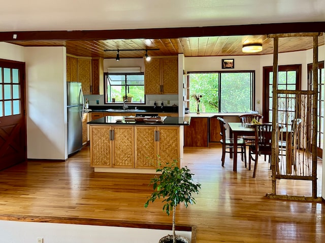 kitchen with stainless steel refrigerator, wooden ceiling, light wood-type flooring, beam ceiling, and sink