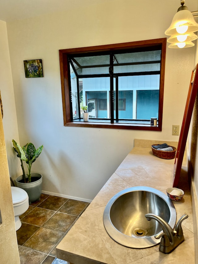 bathroom with vanity and toilet