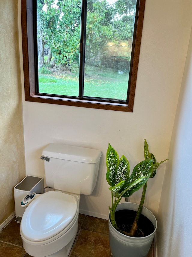 bathroom with toilet and tile patterned floors