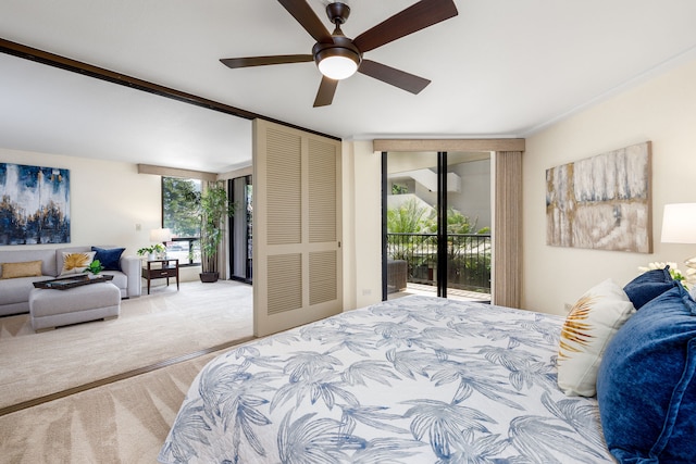 bedroom featuring multiple windows, access to outside, light carpet, and ceiling fan