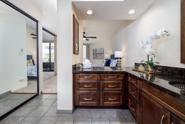 bathroom featuring vanity and ceiling fan